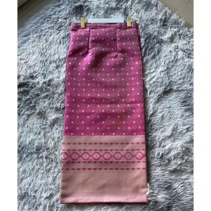 The "Rosy Radiance – Traditional Laotian Sinh Skirt" features a vibrant rose-pink tone enriched with delicate gold-threaded brocade
